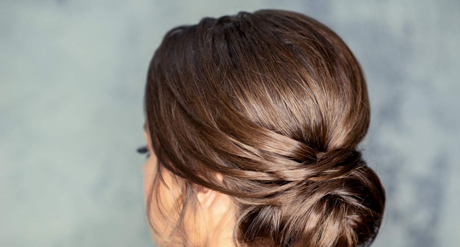 14. Triple Twisted Low Bun With Pearl Accents