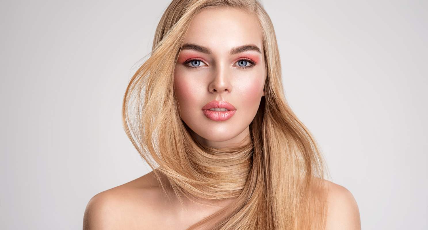 3. Elegant French Twist With Side-swept Bangs