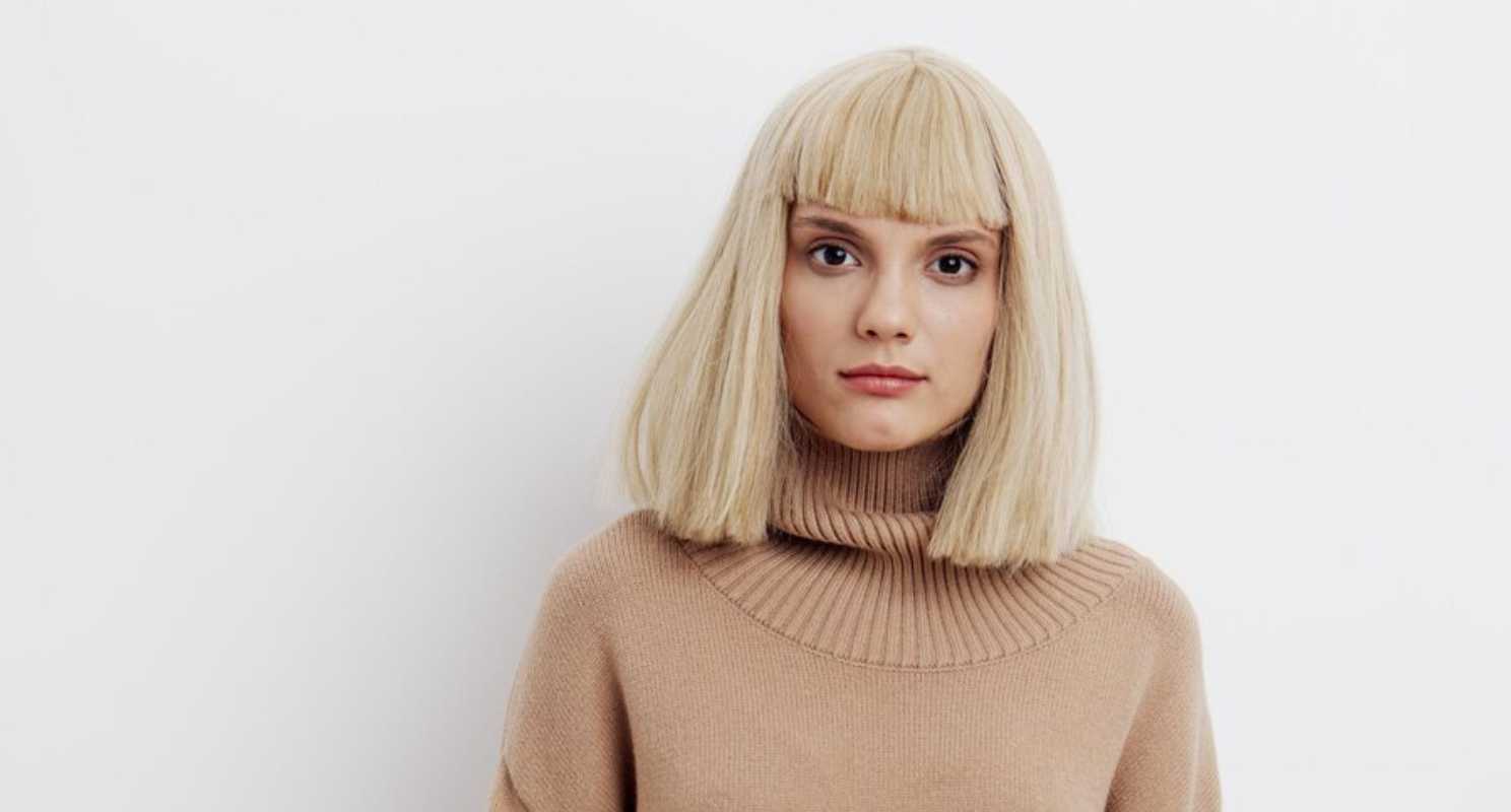 10. Warm Blonde Fluffy Bob With Fringe