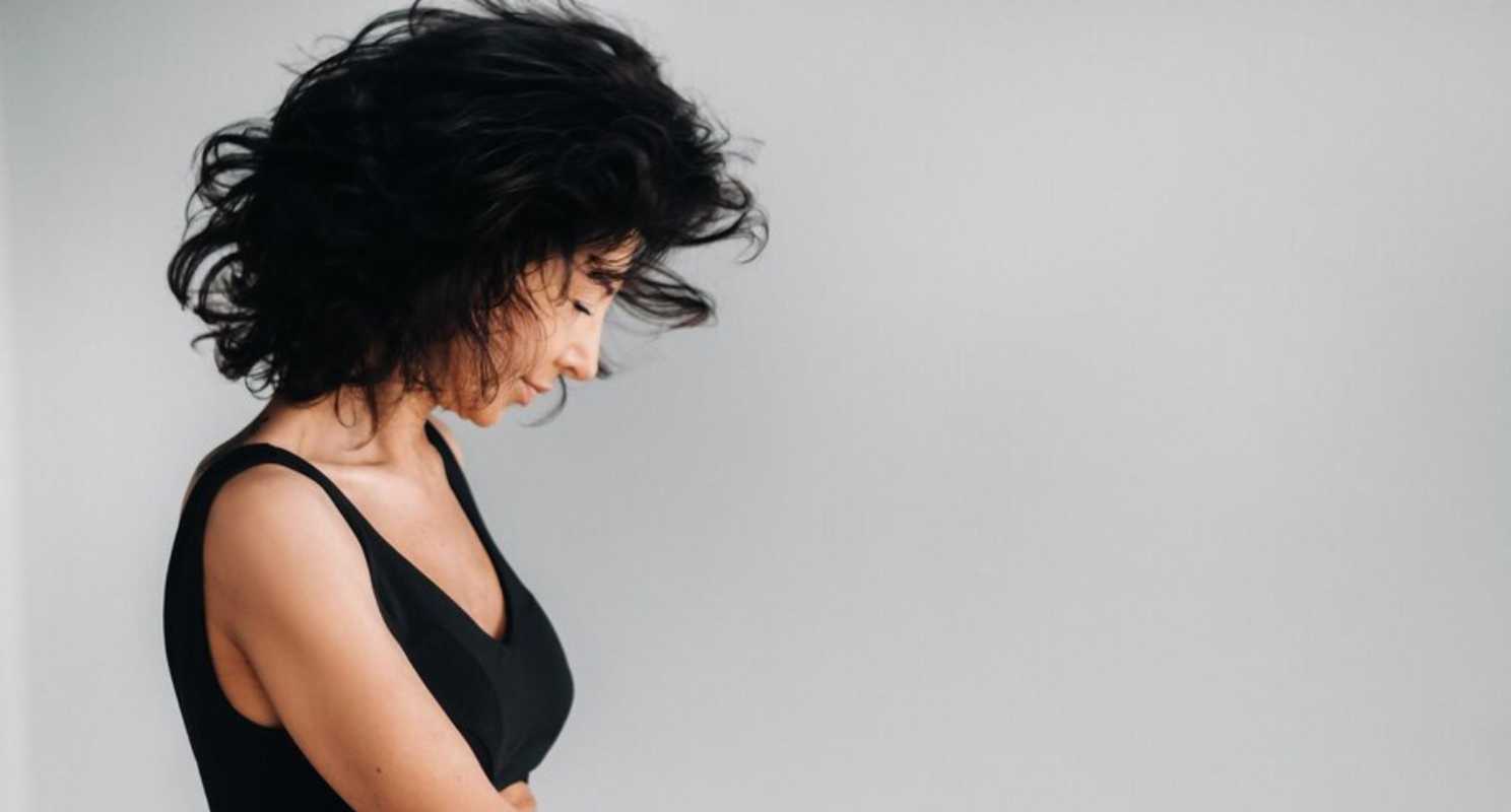 18. Side Parted Voluminous Black Hair