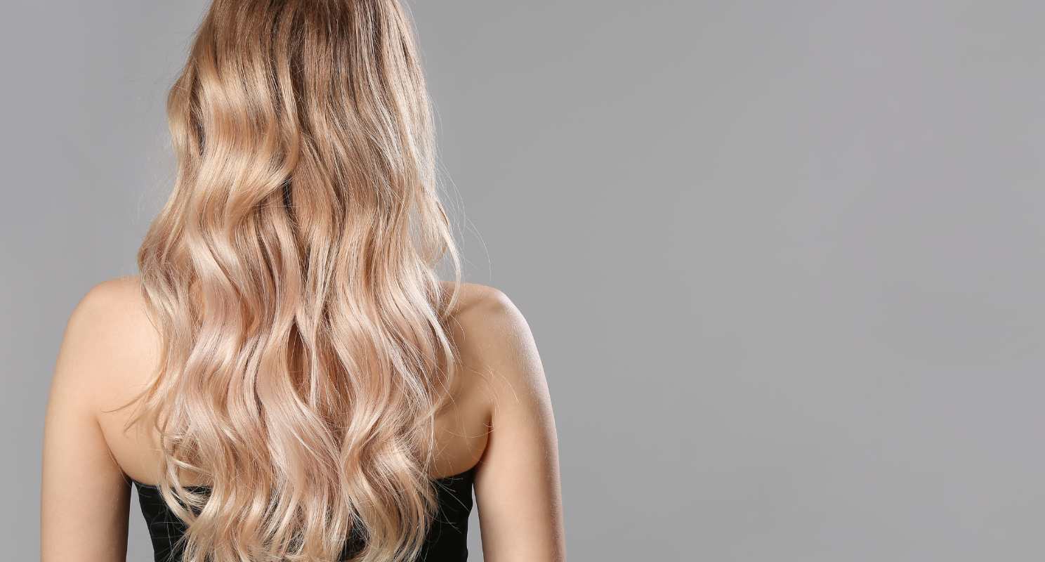 18. Textured Long Wavy Layered Hair With Bronde Highlights