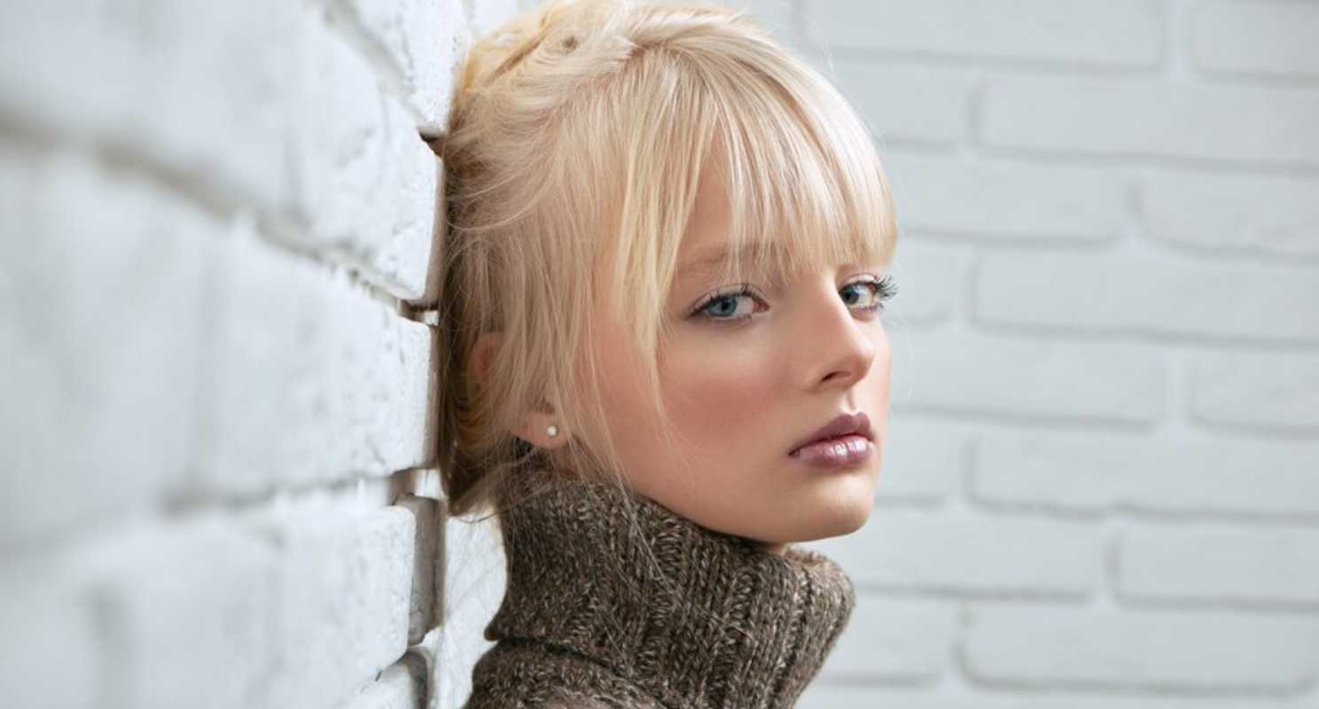20. Fluffy Blonde Layered Bob With Curtain Bangs