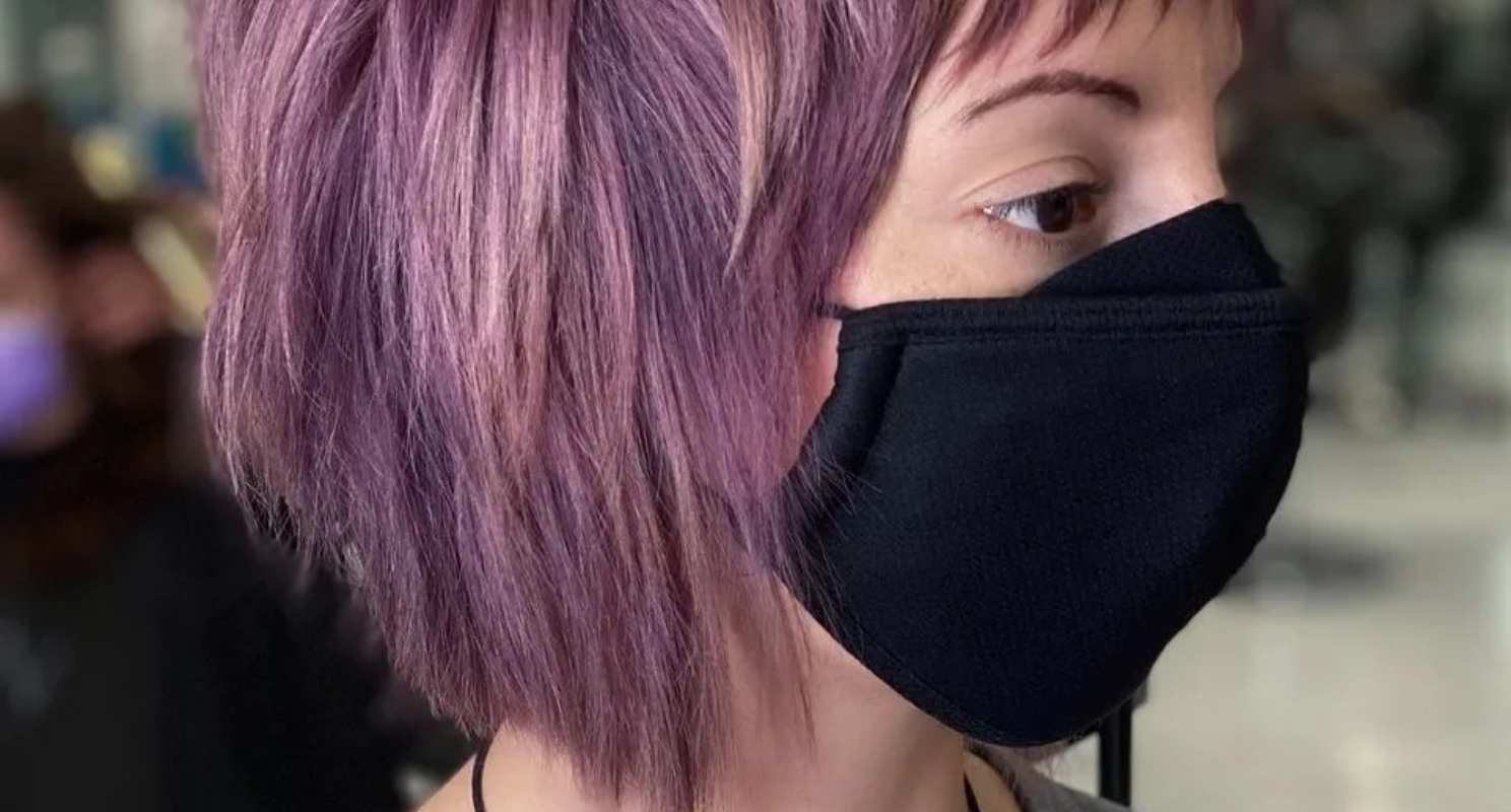 Medium Shaggy Wolf Cut With Choppy Bangs on Pastel Pink Hair